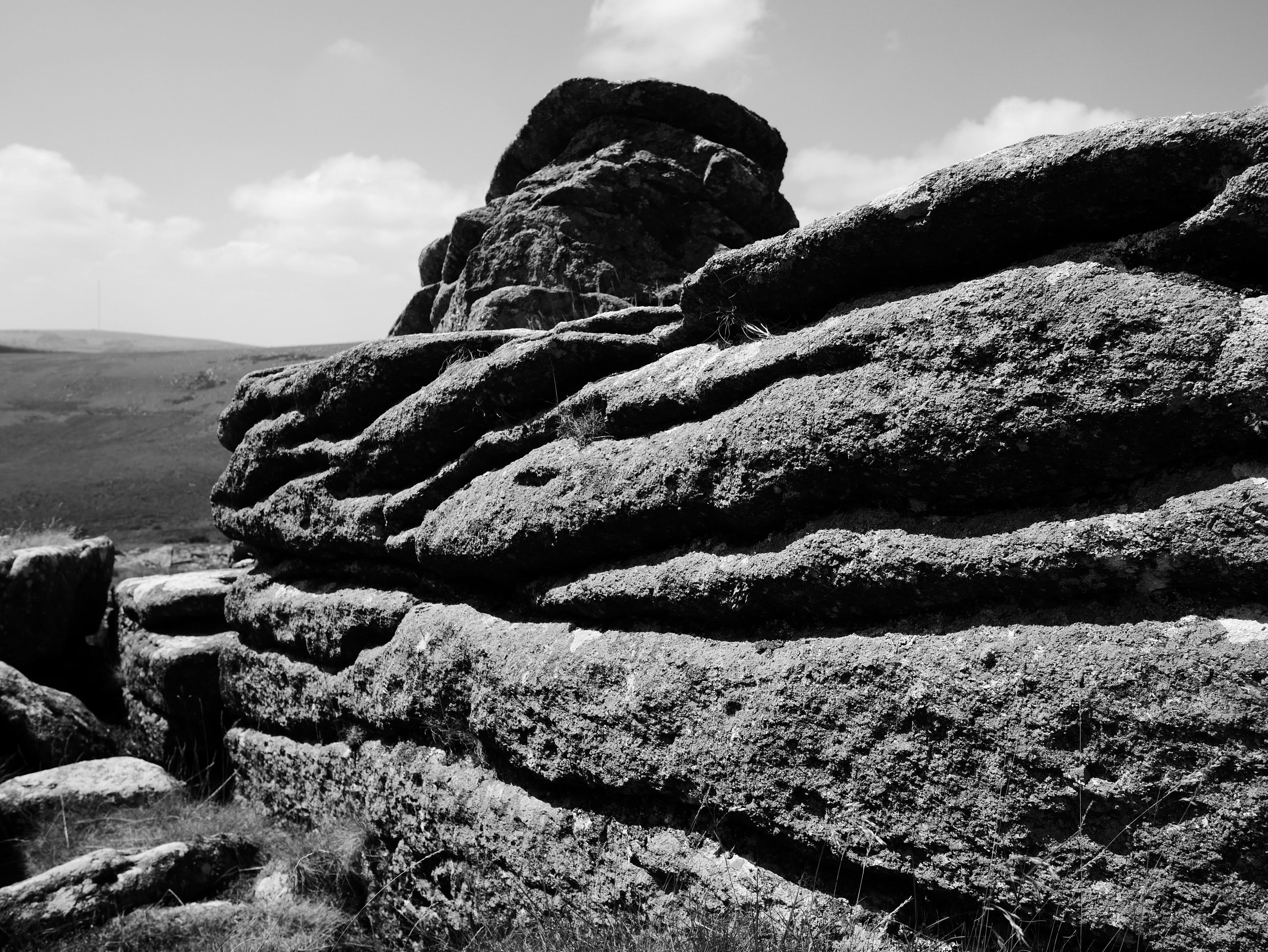 Rugged rocks under a bright sky.