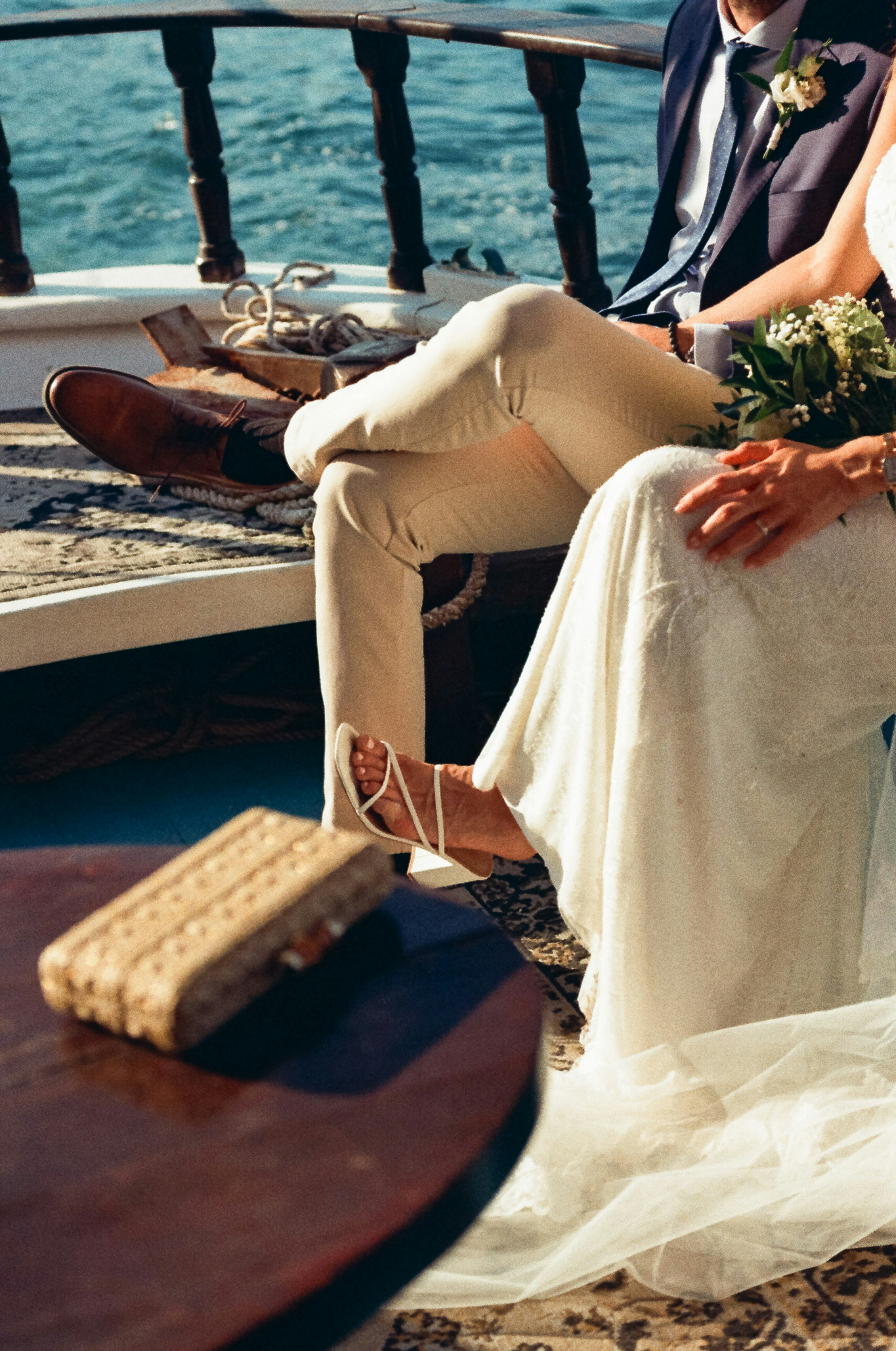 Bride and groom on a boat, celebrating their wedding.