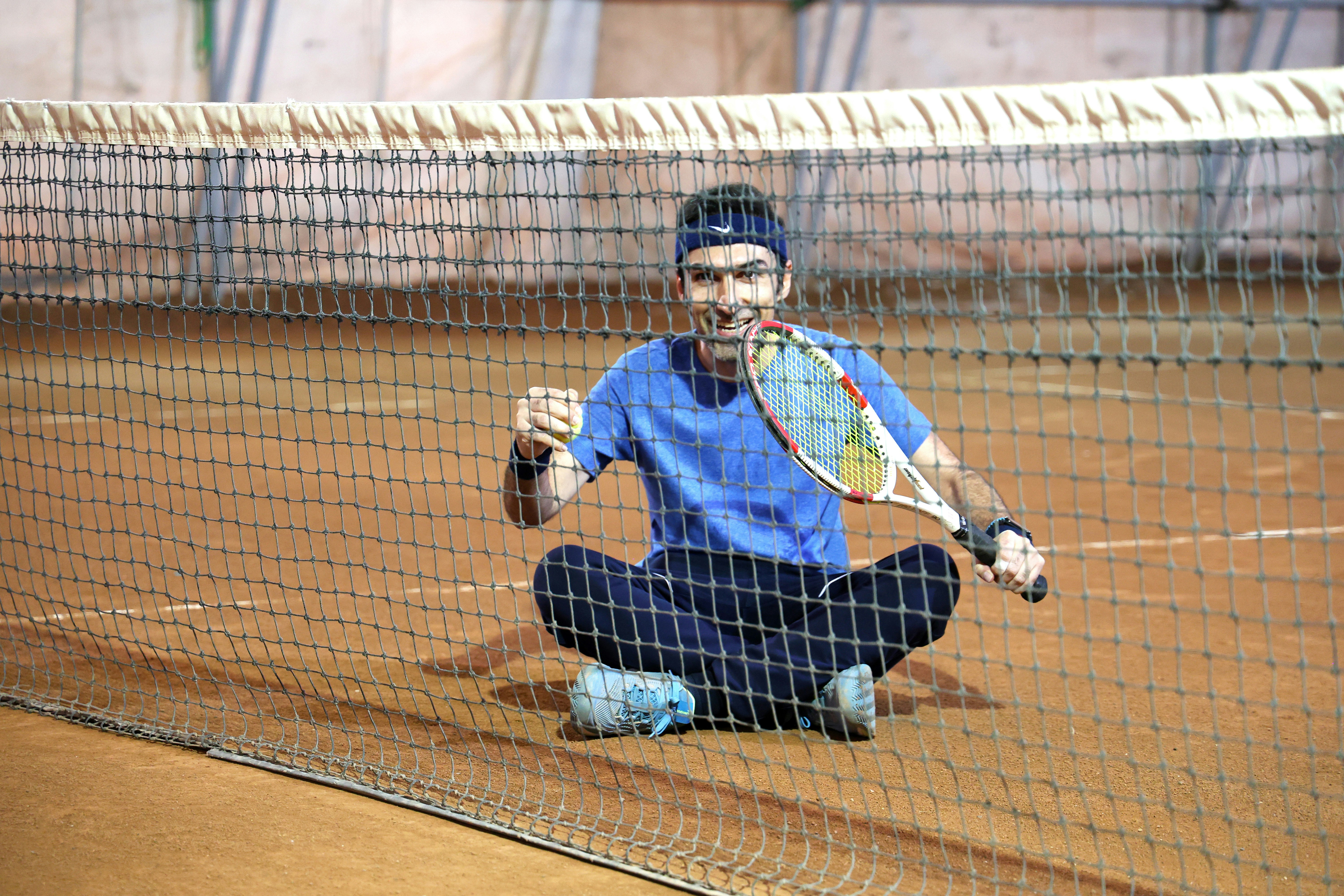 Professional tennis player celebrating victory