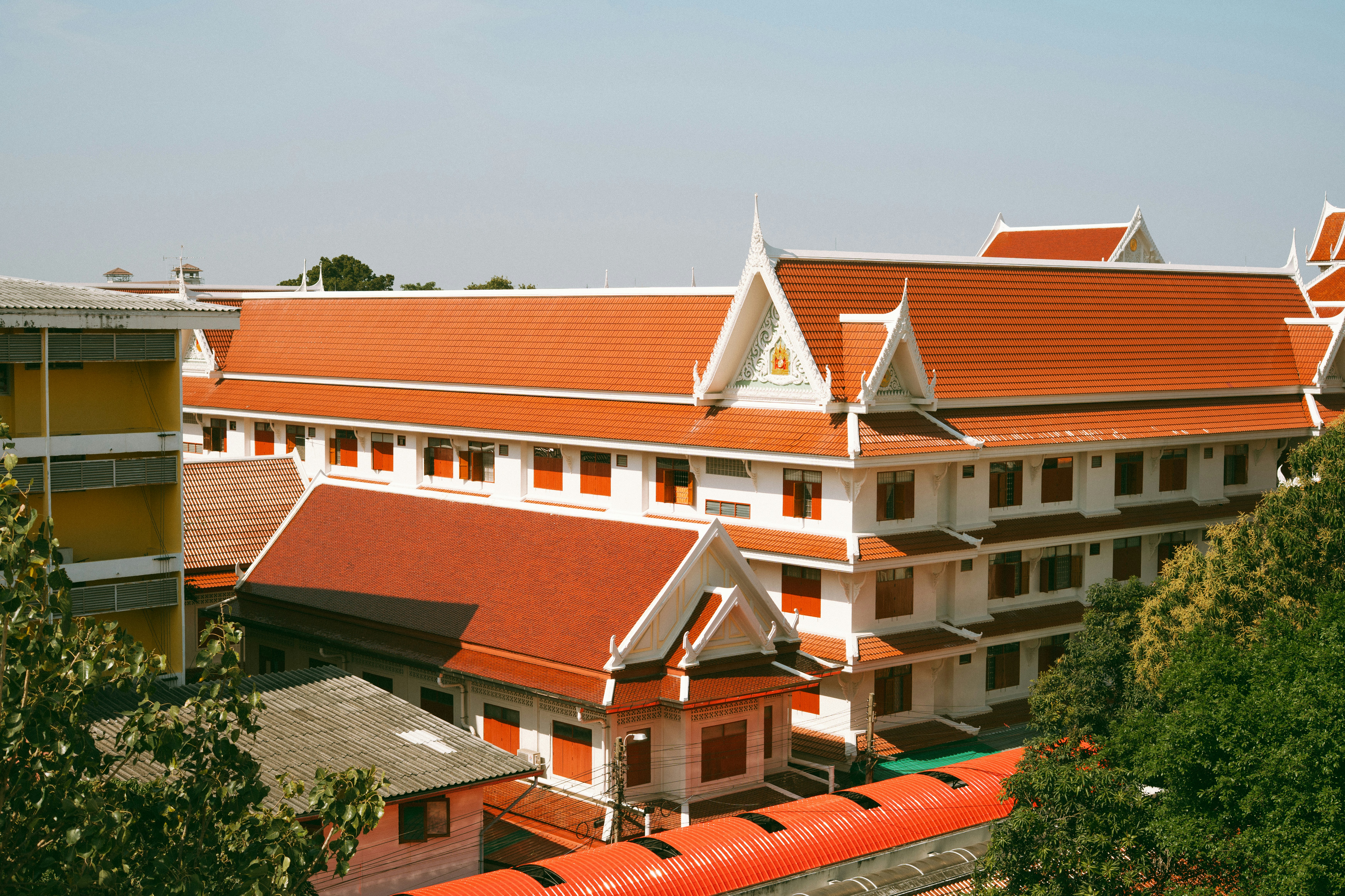 Beautiful thai temple buildings with orange roofs.