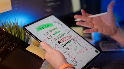 A person reviews a "to do" list on a tablet.