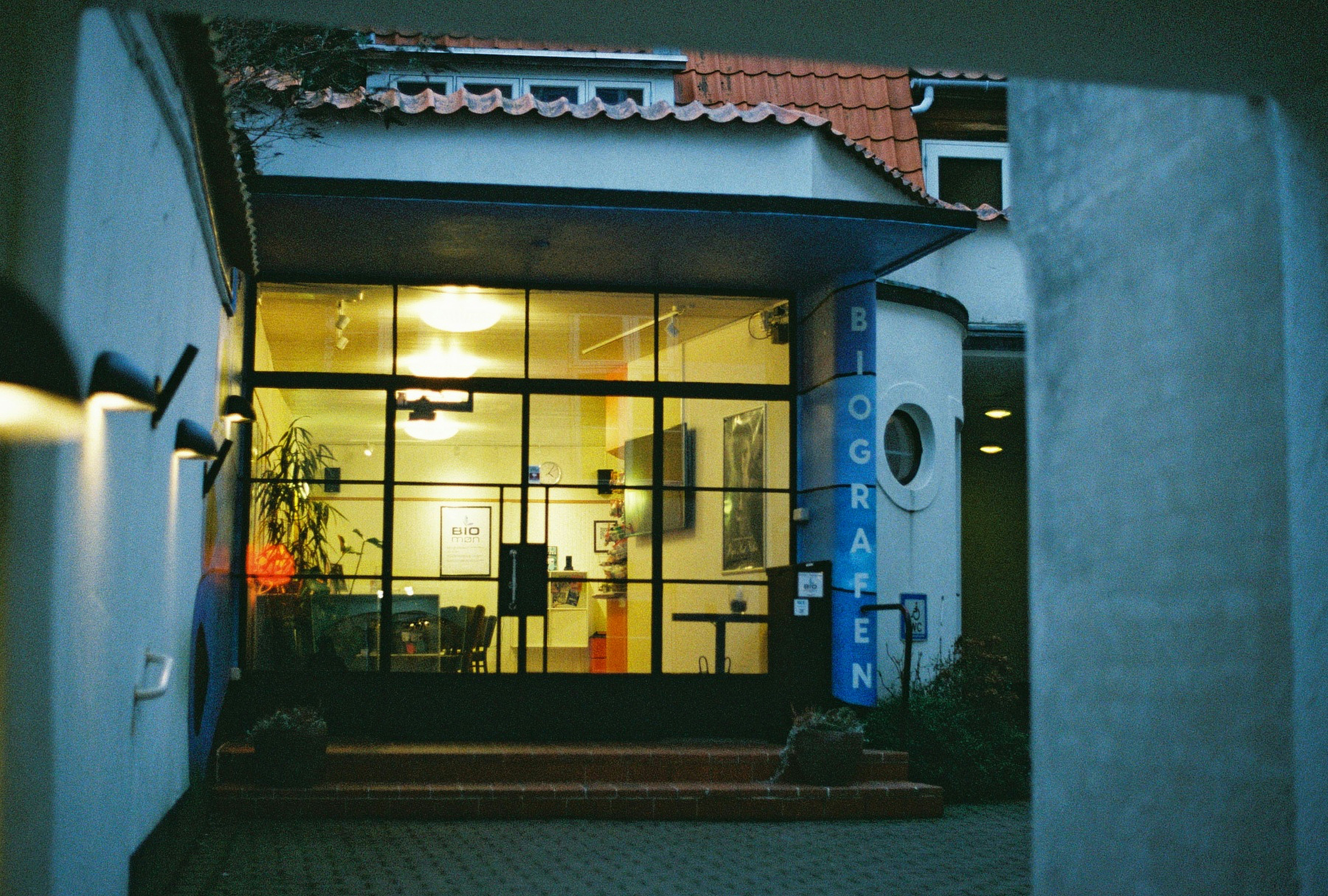 The illuminated entrance of a cinema.