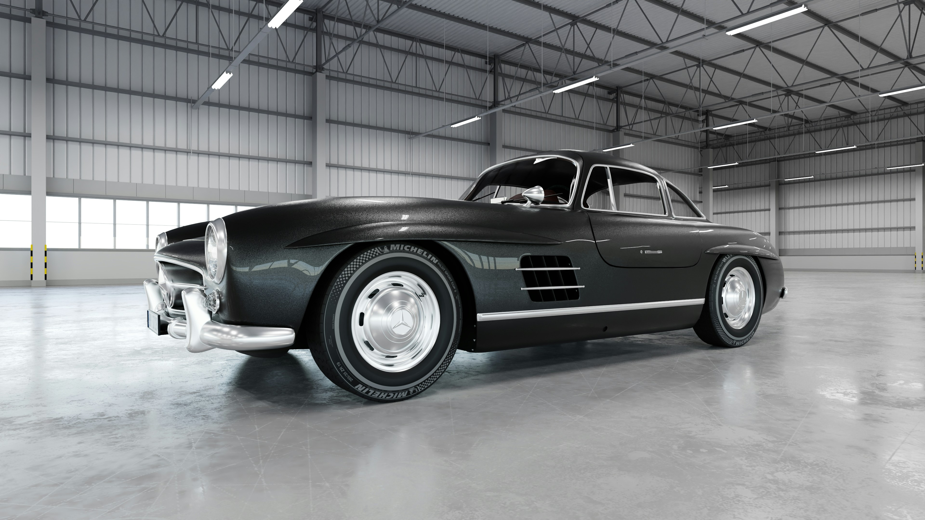 Un auto negro clásico se encuentra en un gran garaje.