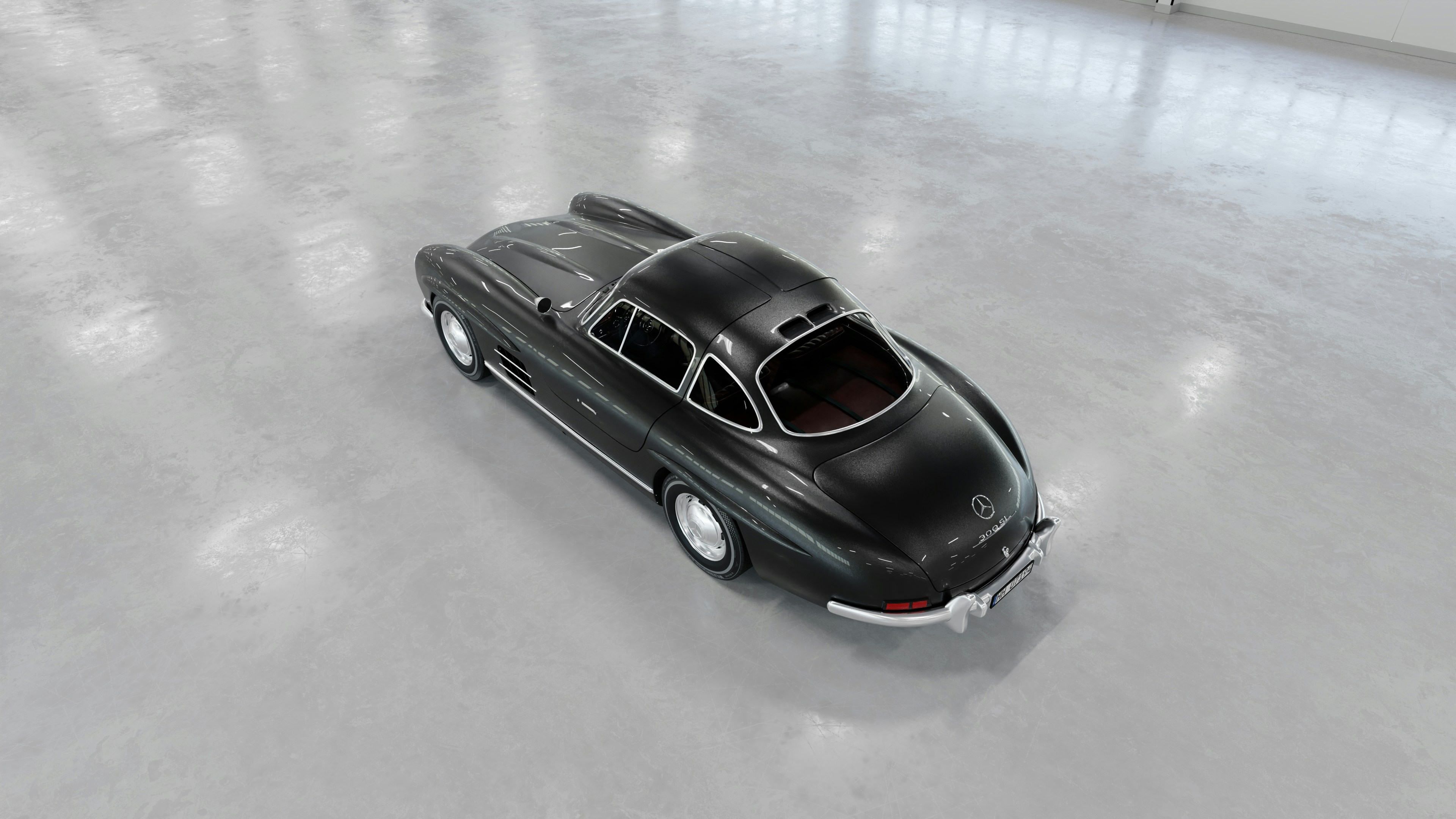 Se muestra un elegante y clásico coche negro.