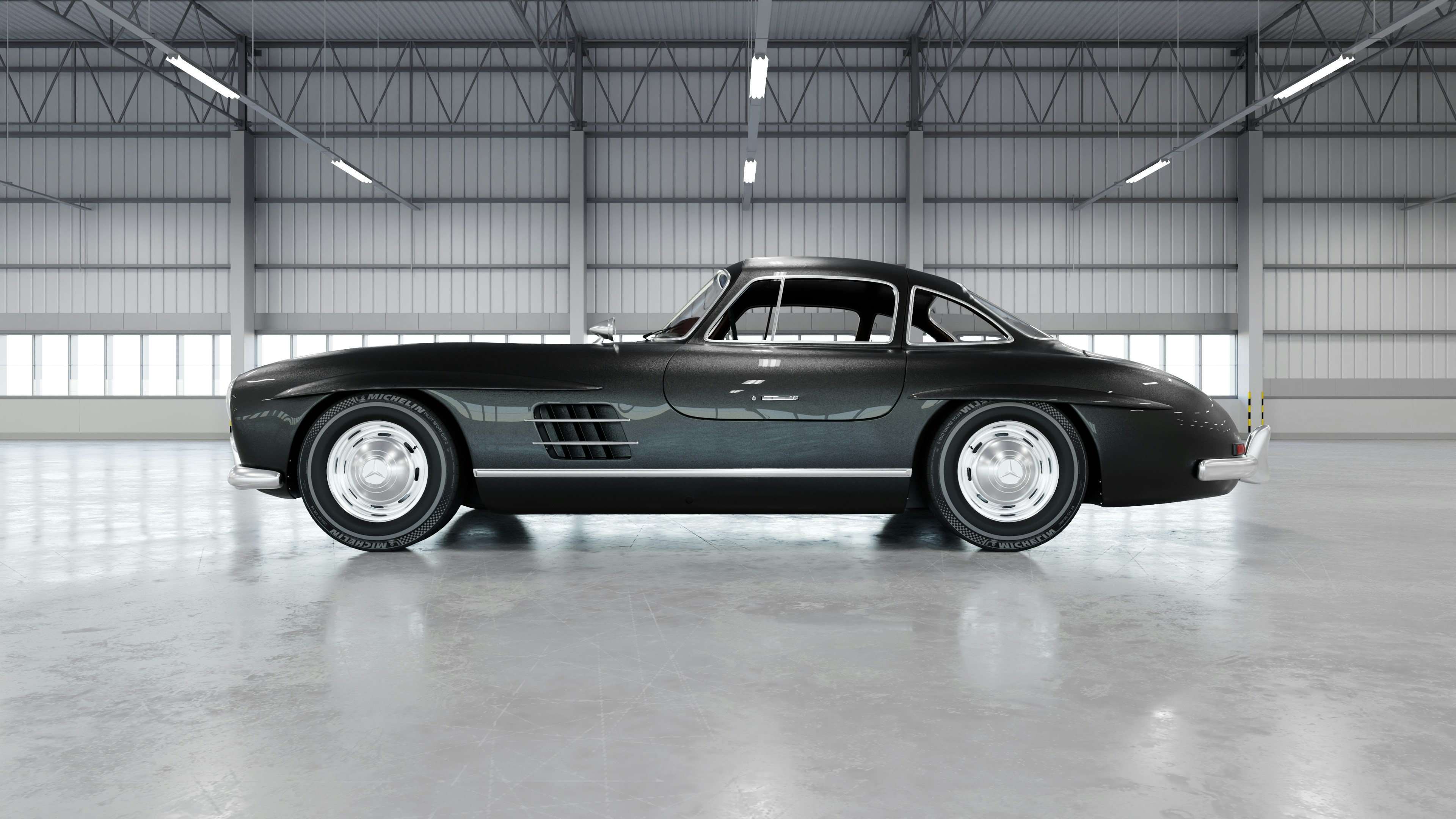 Un elegante auto clásico se encuentra en un hangar brillante.