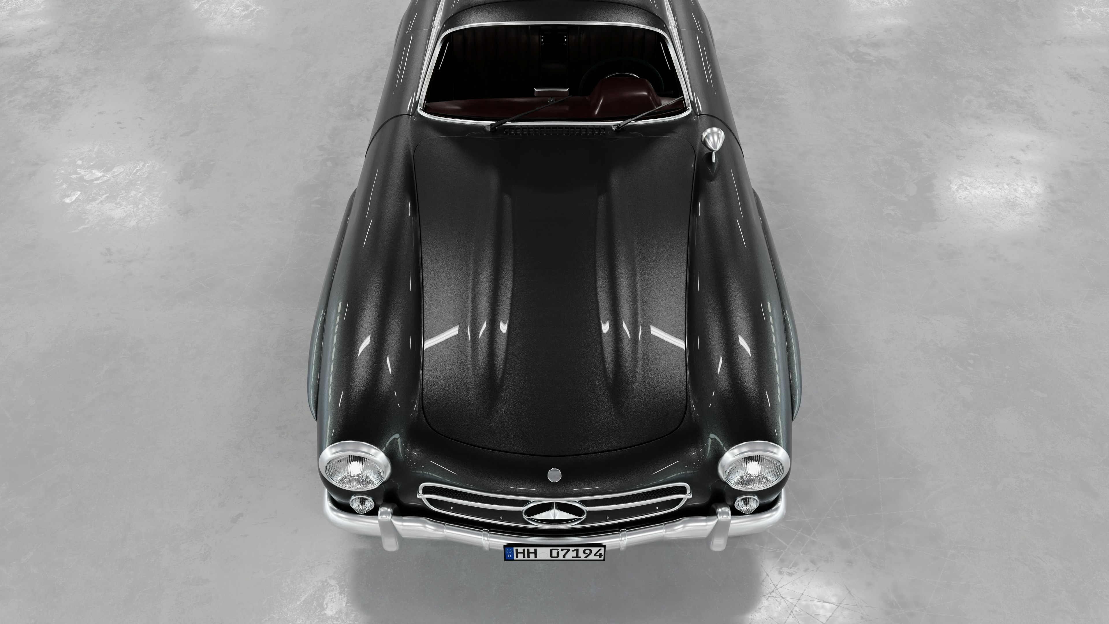 Un coche antiguo negro se muestra desde arriba.