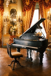 A grand piano sits in an elegant room.
