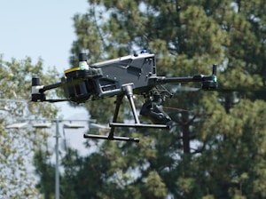 A drone flies in the sky.