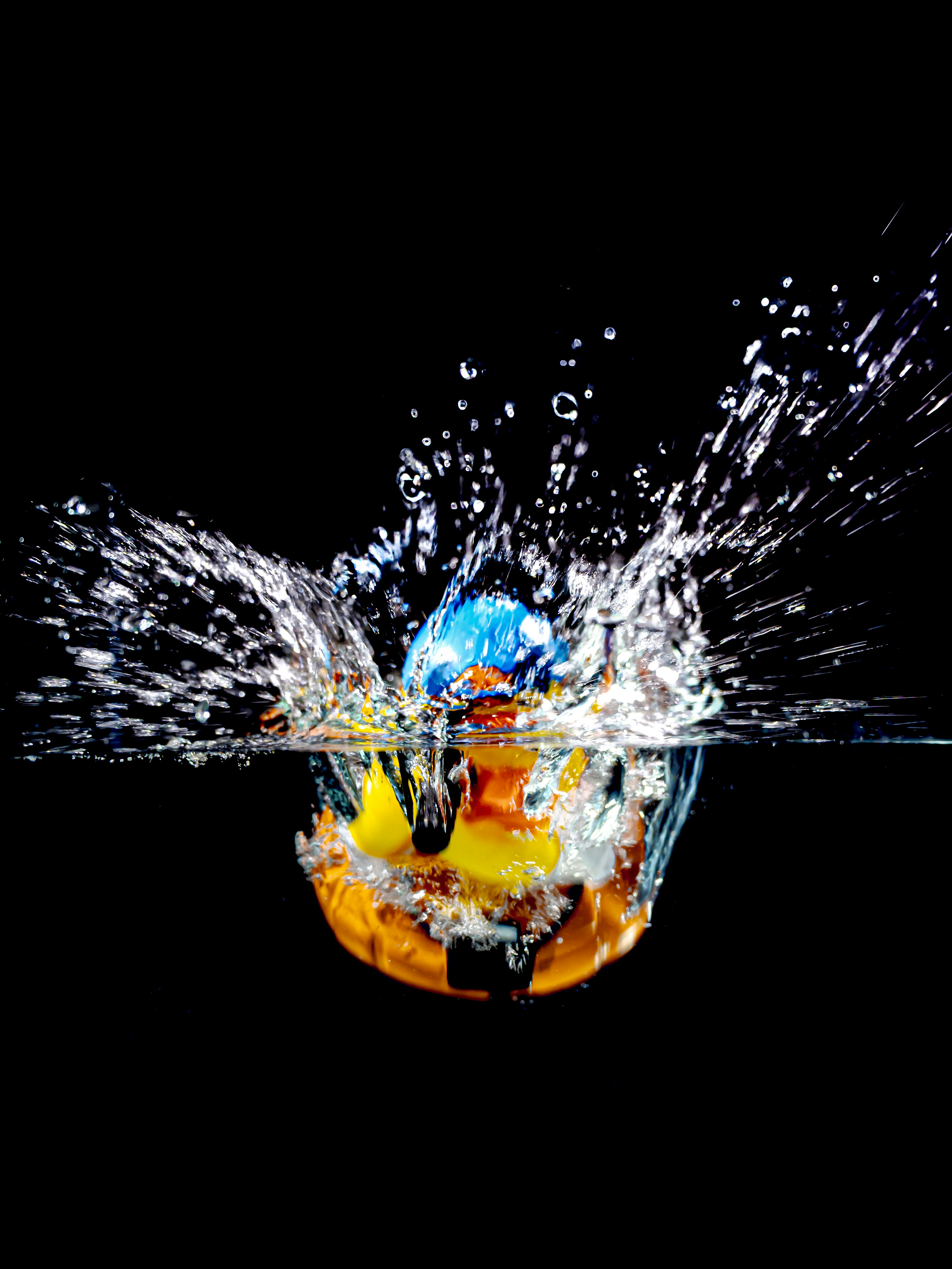 A pumpkin and ball splash into water. photo – Free Splash Image on Unsplash