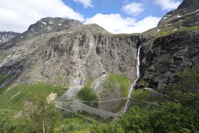 Waterfall cascades down a steep mountain.