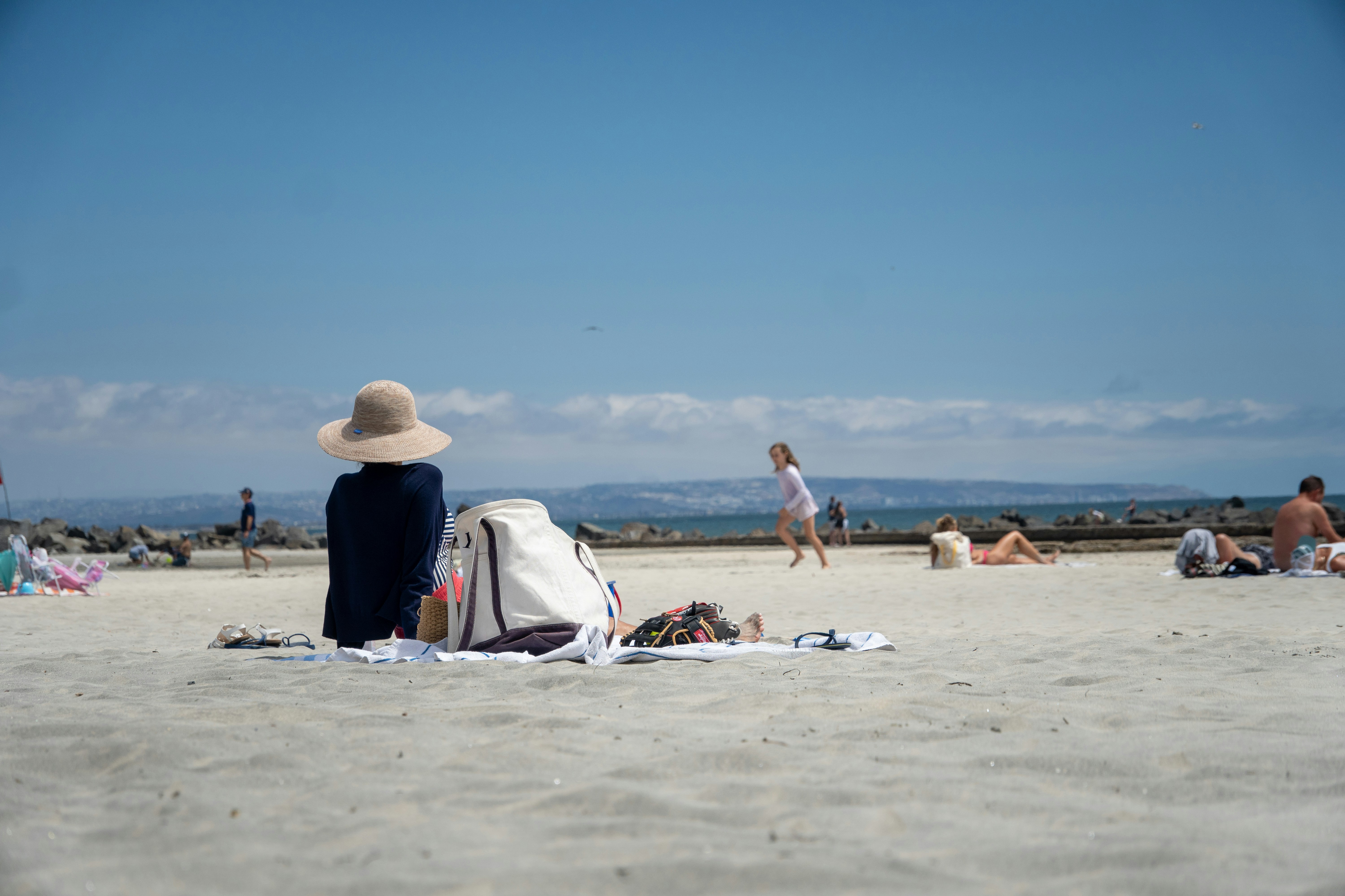 people enjoying a sunny day at Montrose Beach - uptown chicago neighborhood