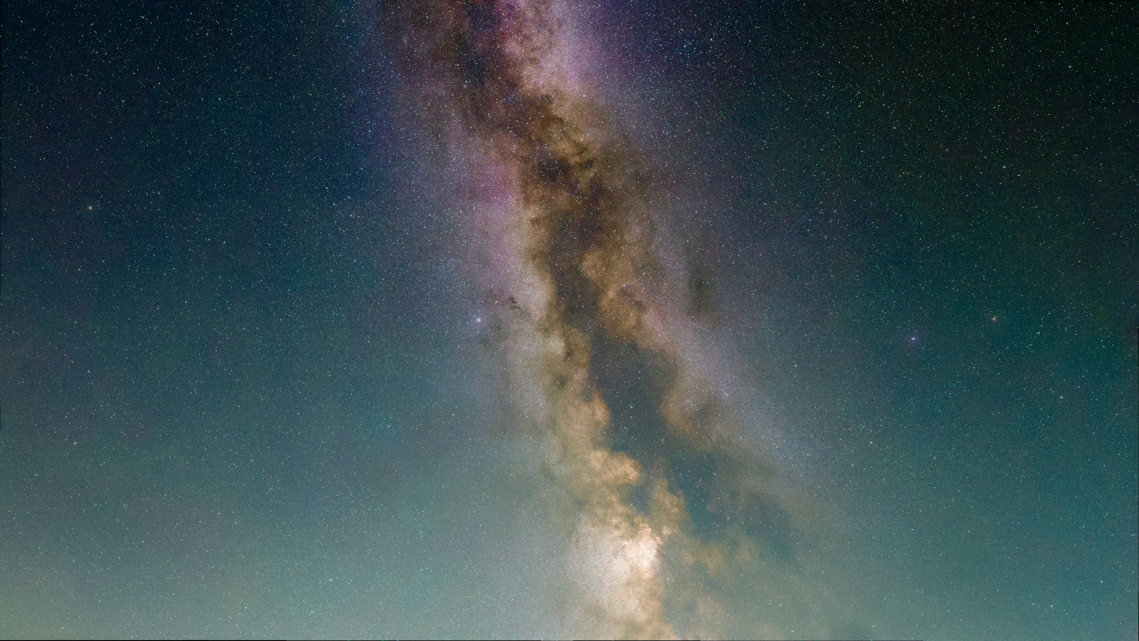 The milky way galaxy shines brightly at night.