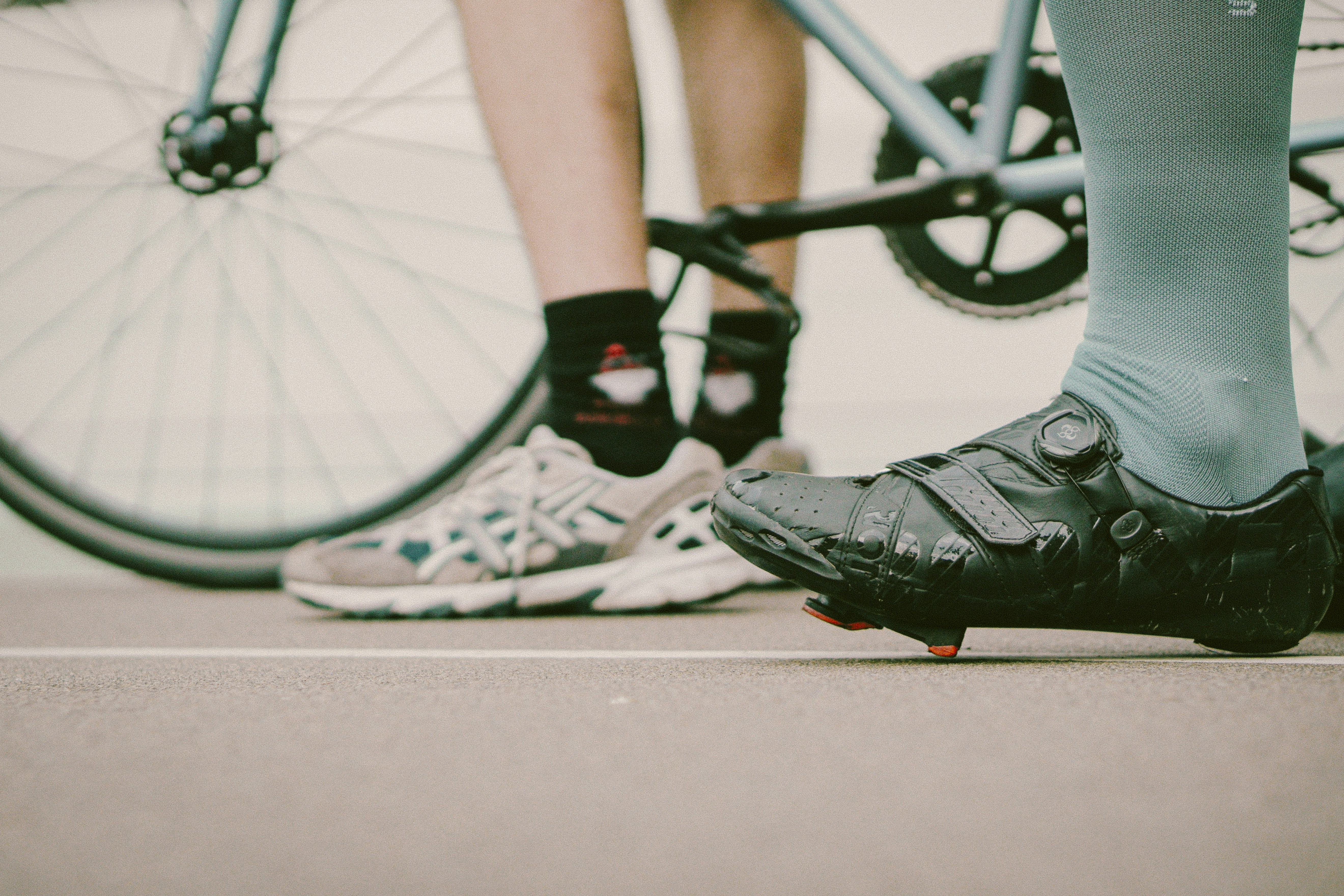 Cyclists gathered near a bicycle