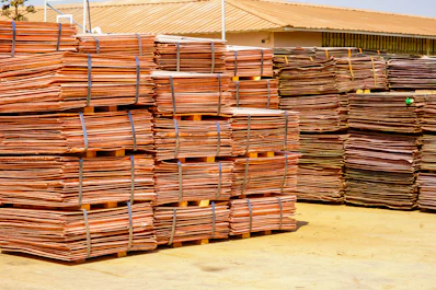 Piles of copper sheets stacked for storage.