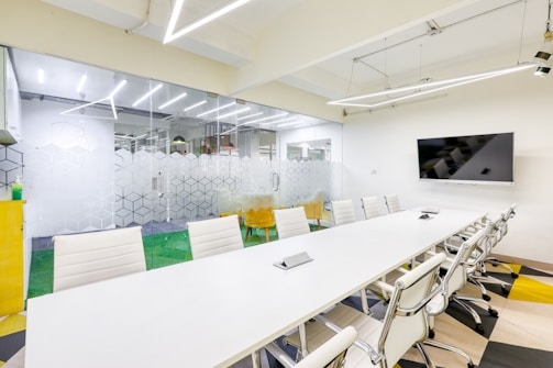 A modern conference room is ready for a meeting.
