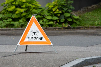 Drone fly zone sign on the ground.