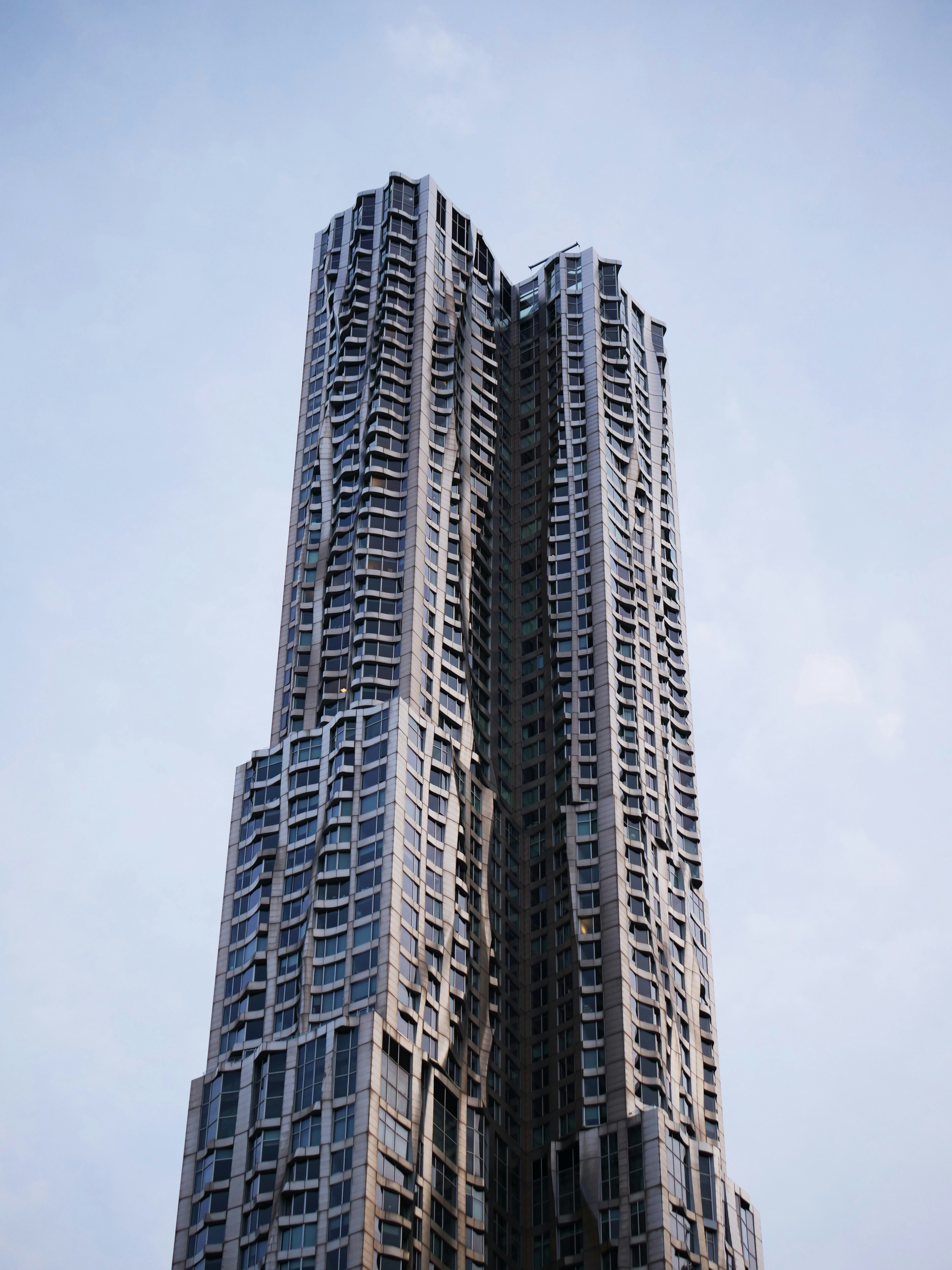 A tall, modern skyscraper reaches for the sky.