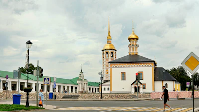 White churches with gold domes in the town centre — Suzdal, Russia