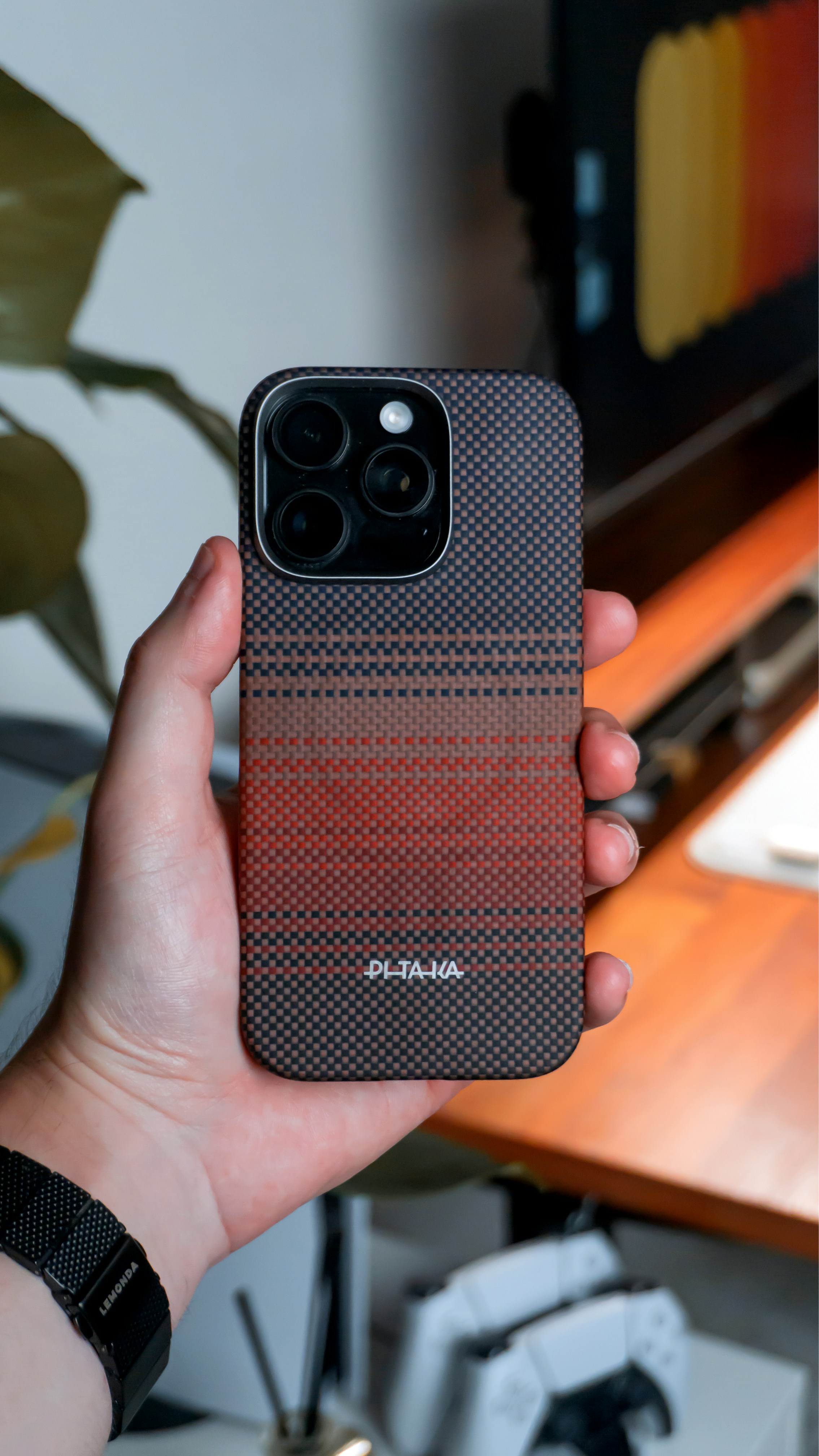 A sleek magnetic power bank attached to a phone.