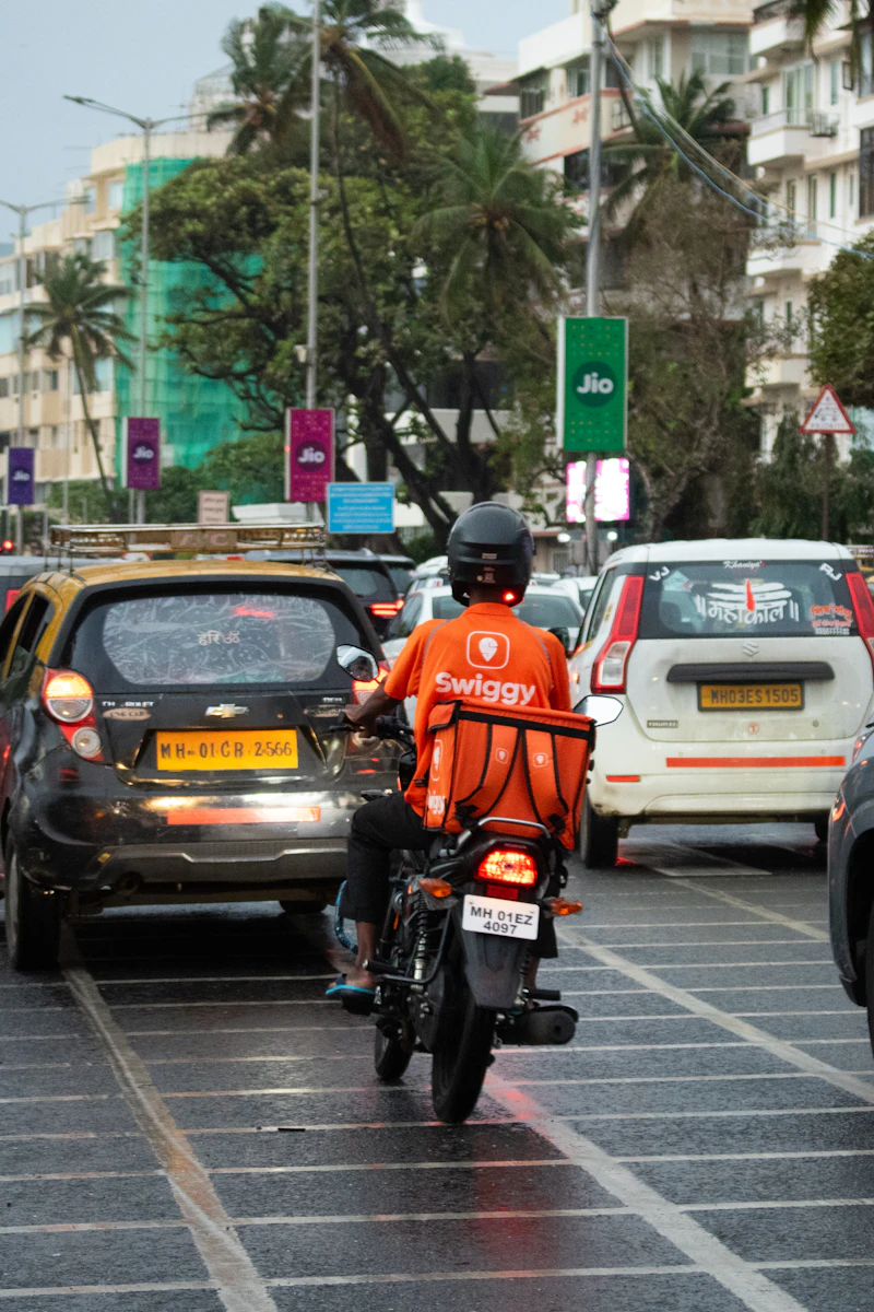 Dispatch rider in transit through city traffic