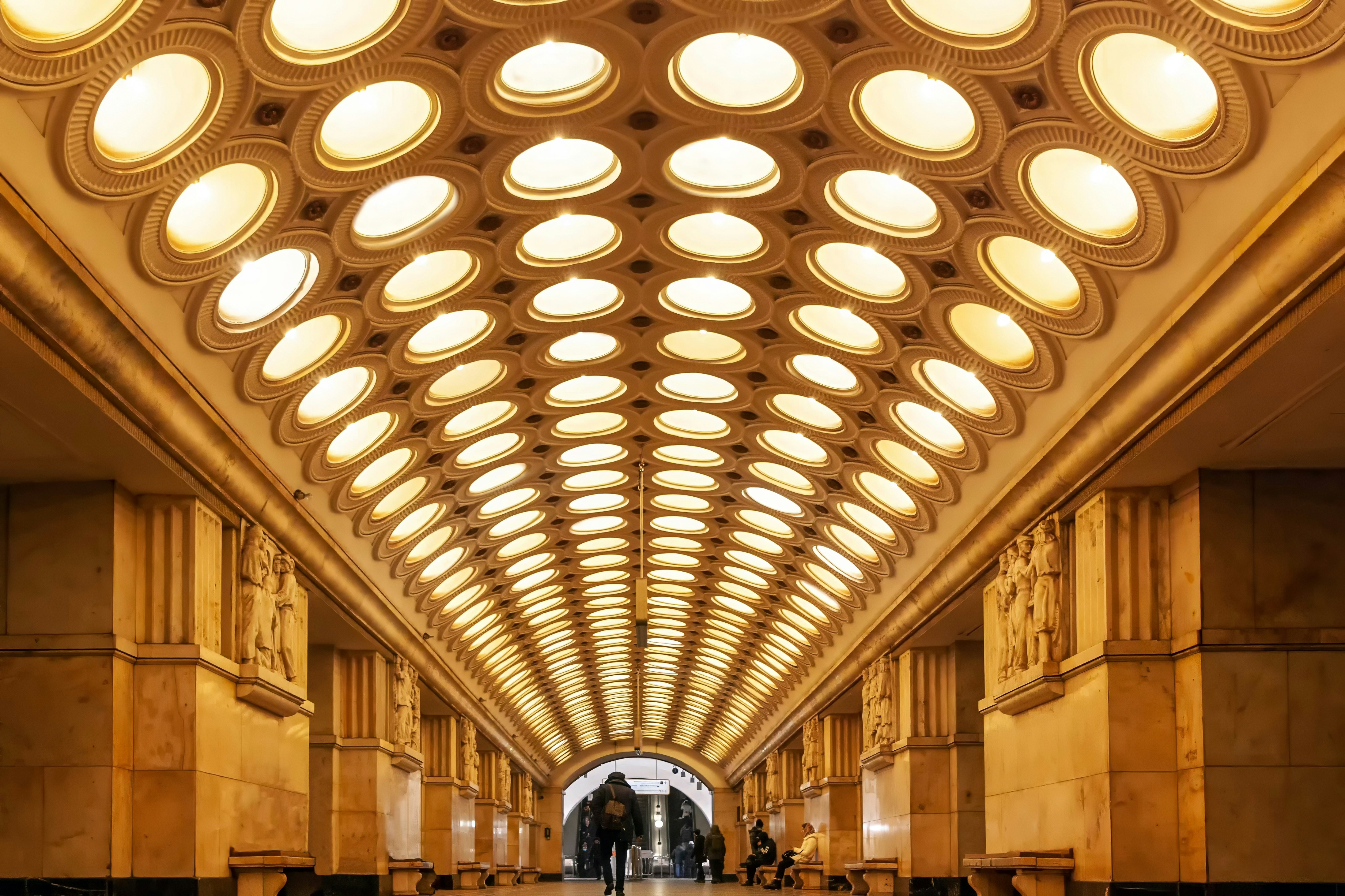 An ornate tunnel with a patterned ceiling.