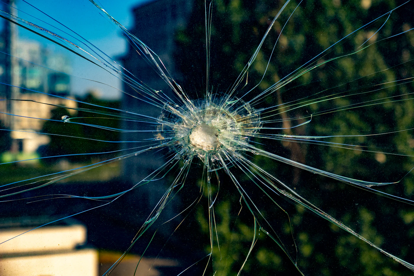 Security glass pane that held together after a ballistic impact