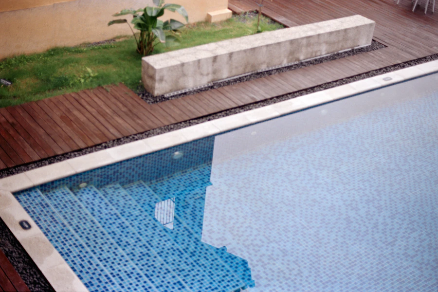 Swimming pool with steps and wooden decking