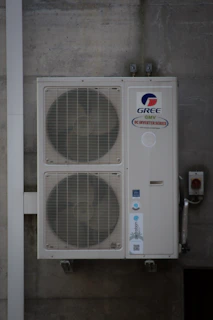 An air conditioning unit is mounted on a wall.