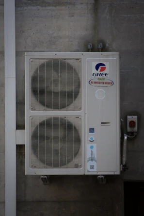 An air conditioning unit is mounted on a wall.