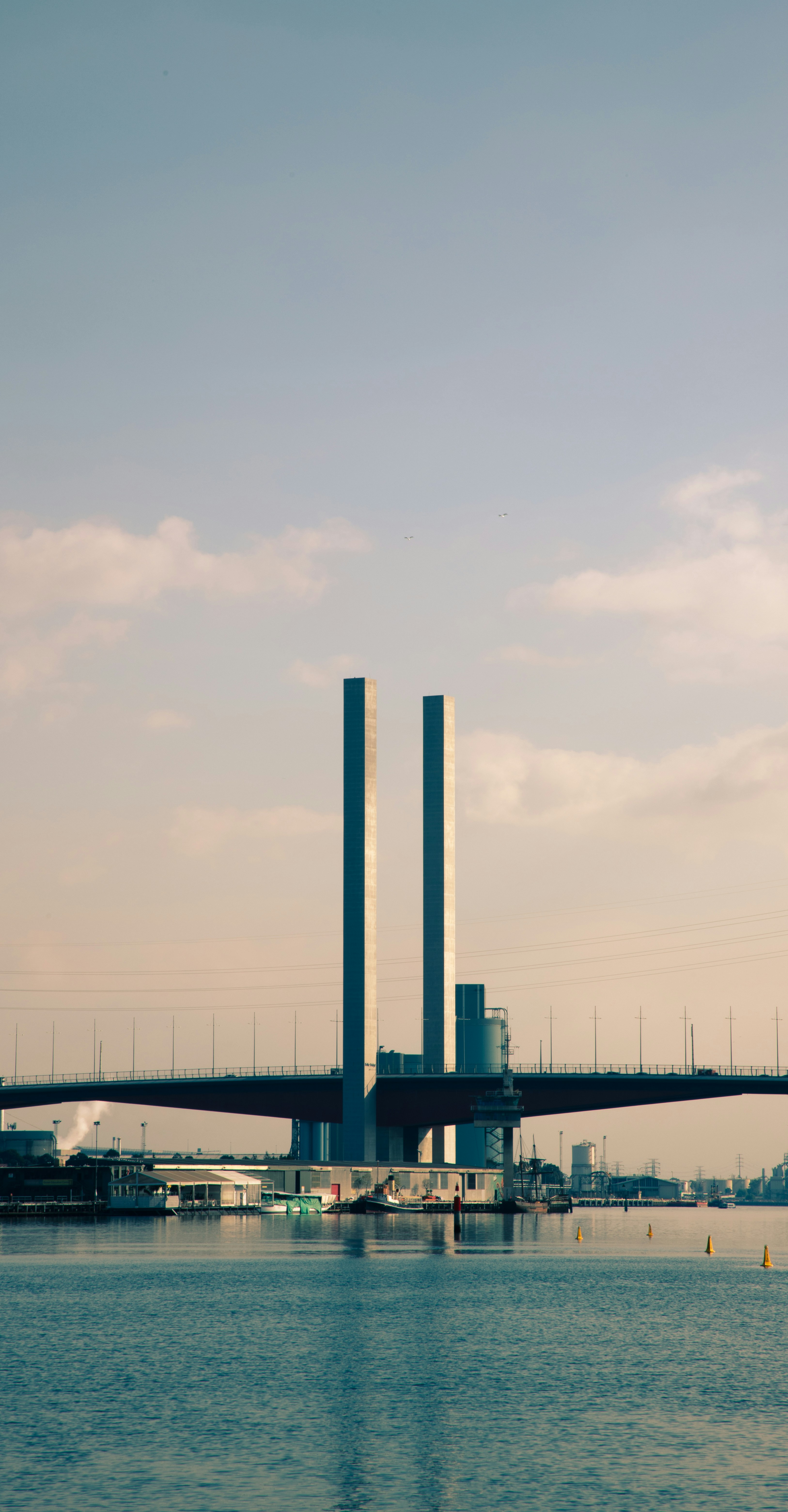 Bridge over water with large towers.