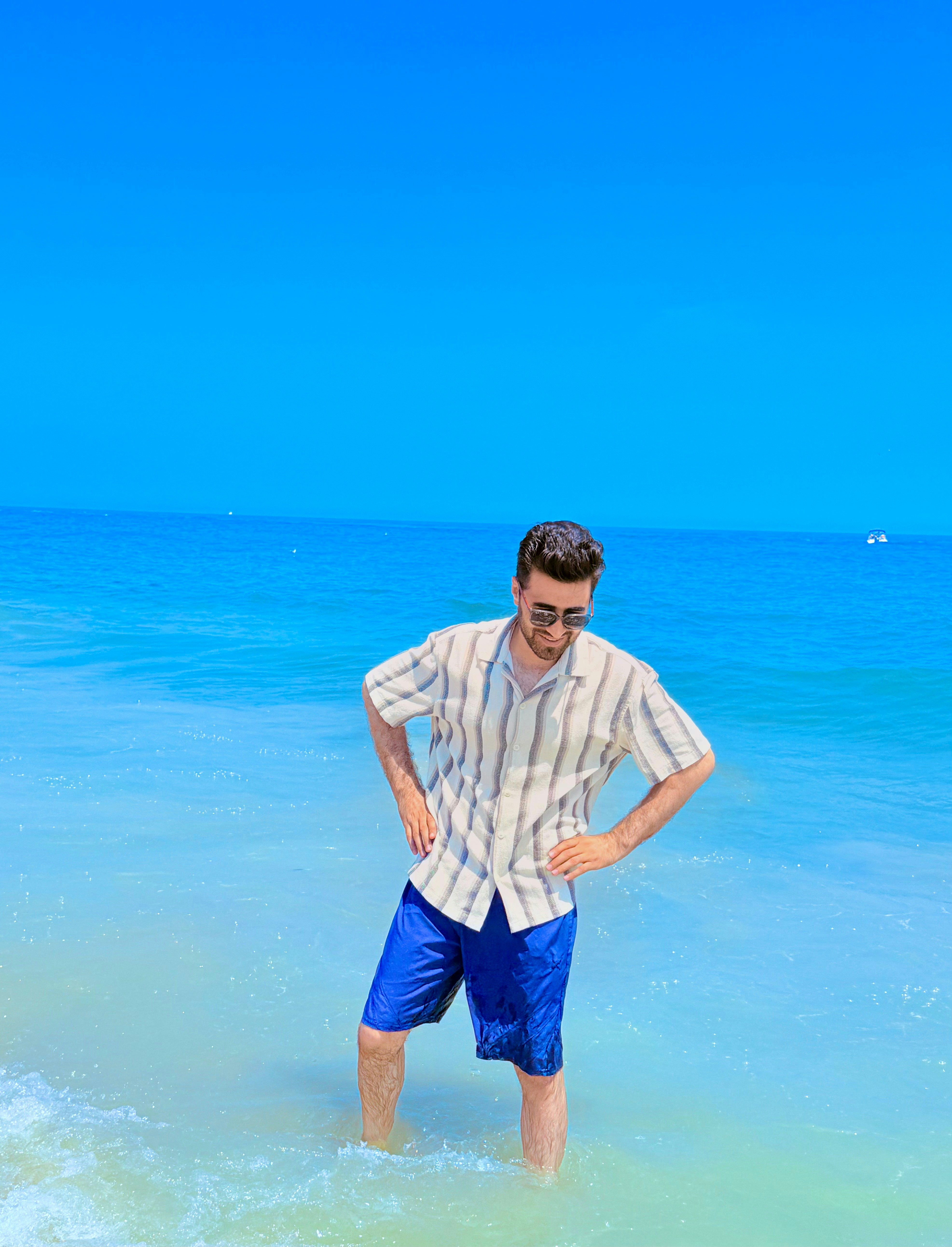 A man stands in the ocean water.