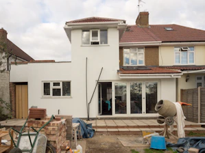 A house under construction is shown.