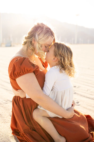 A mother and daughter share a loving moment.