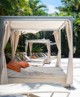 Lounge beds await relaxation by the pool.