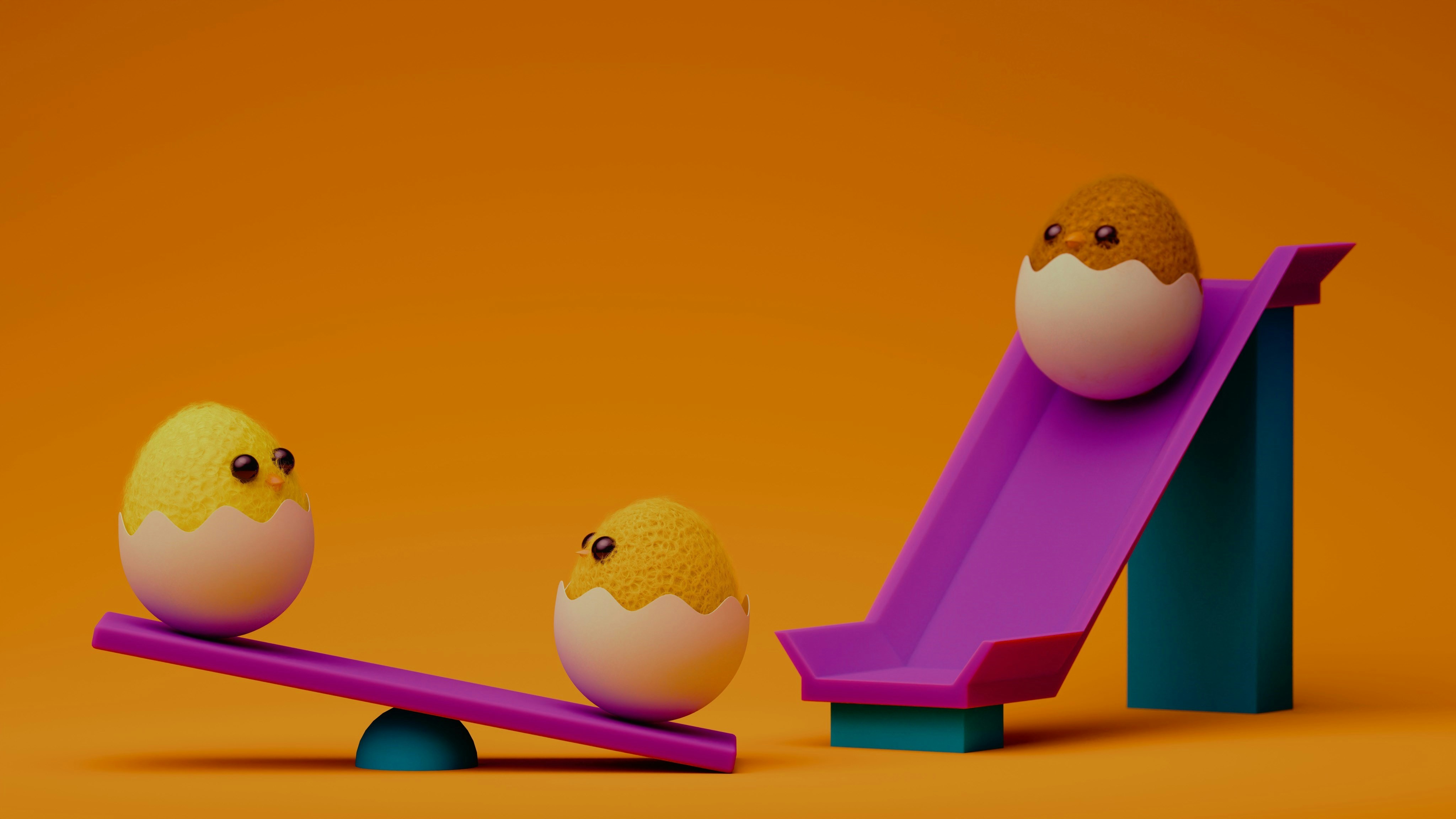 Cute chick-eggs are playing on a playground.