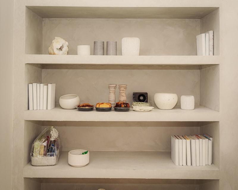 Shelves are filled with decorative objects and books.