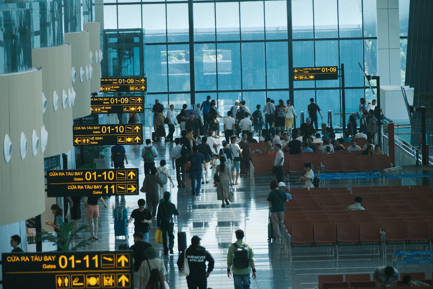 Travelers walking through an airport terminal