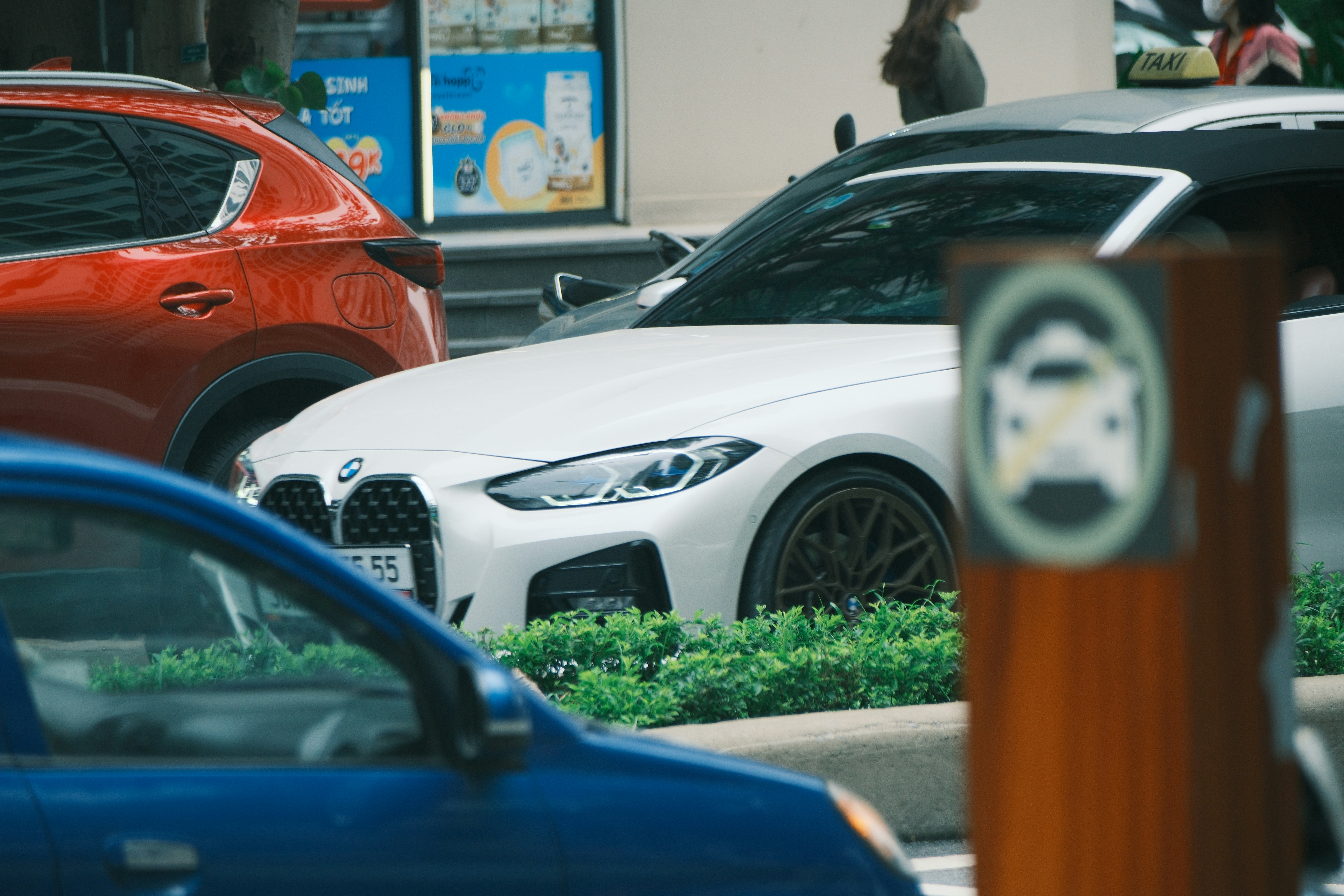 Driver researching and buying a used electric vehicle online from a laptop at home