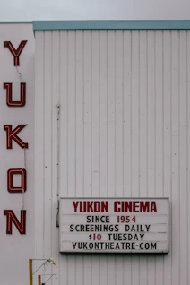 The image shows the yukon cinema's exterior sign.