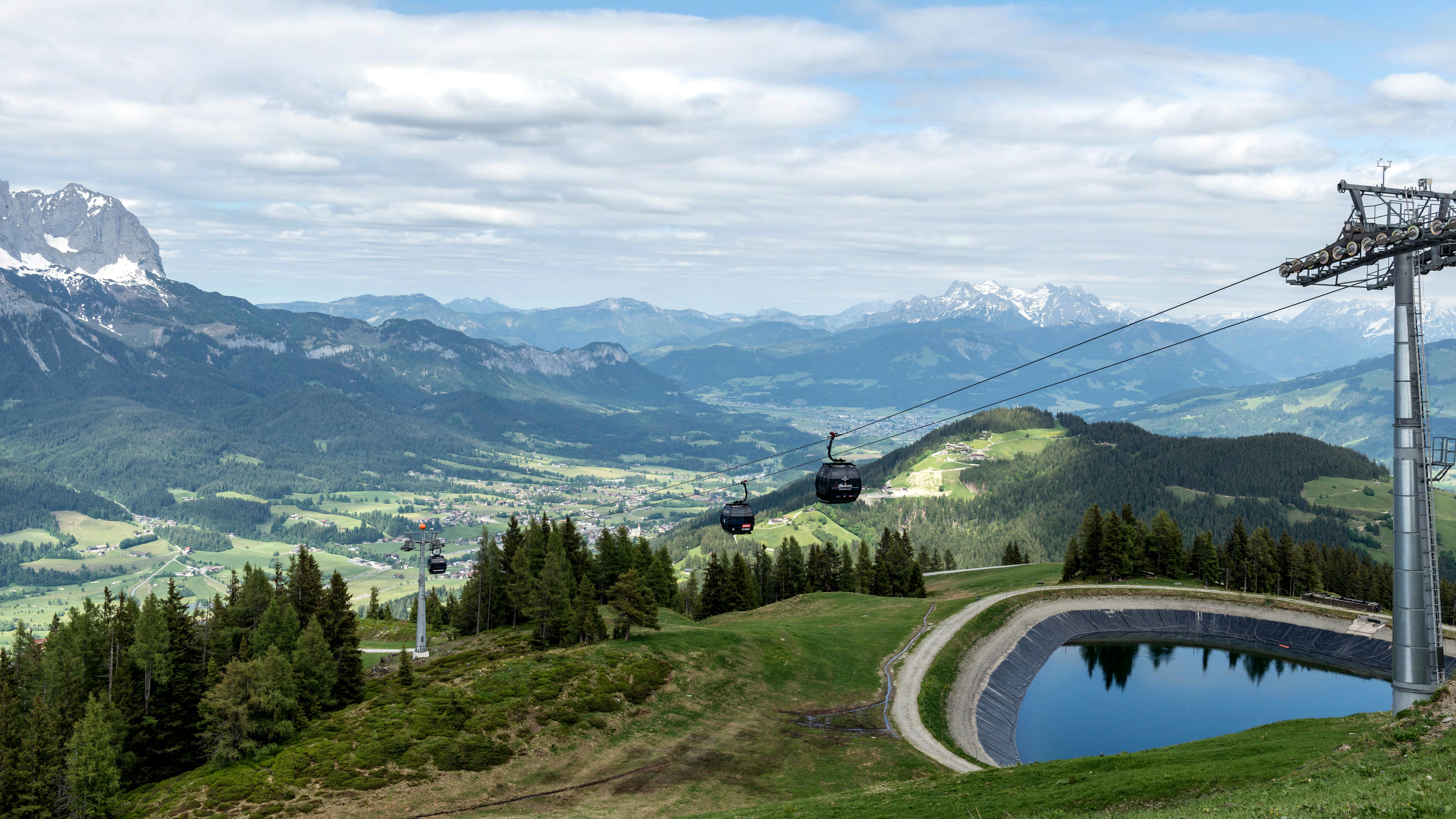 Mountain landscape with a ski lift on a sunny day.