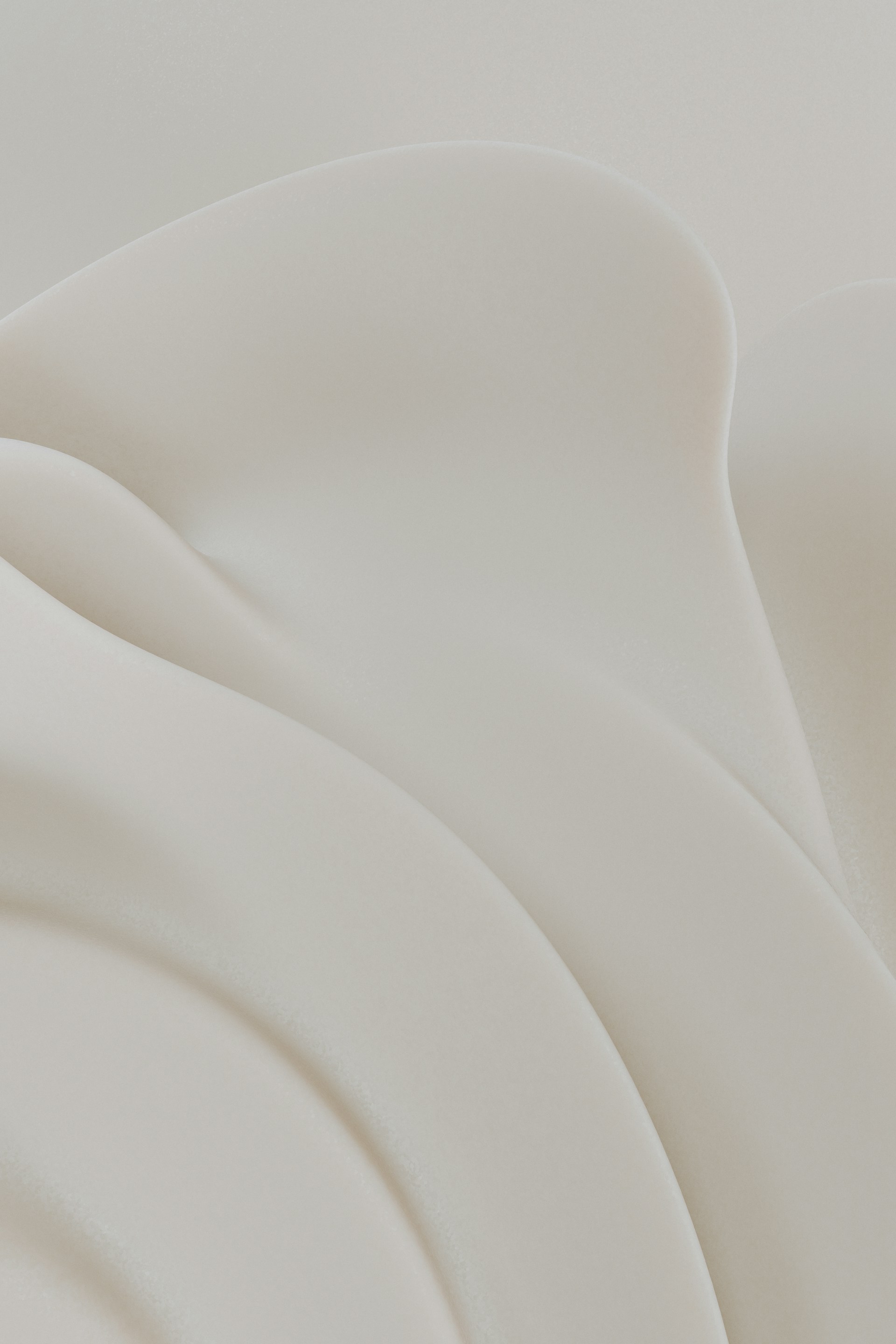 Flowing, creamy fabric forms soft and elegant folds.