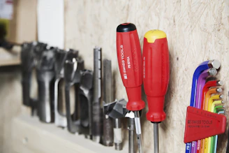 Tools arranged on a wooden wall.