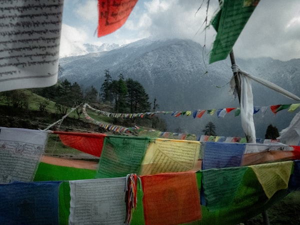 Prayer flags before Himalayan mountain backdrop Nepal