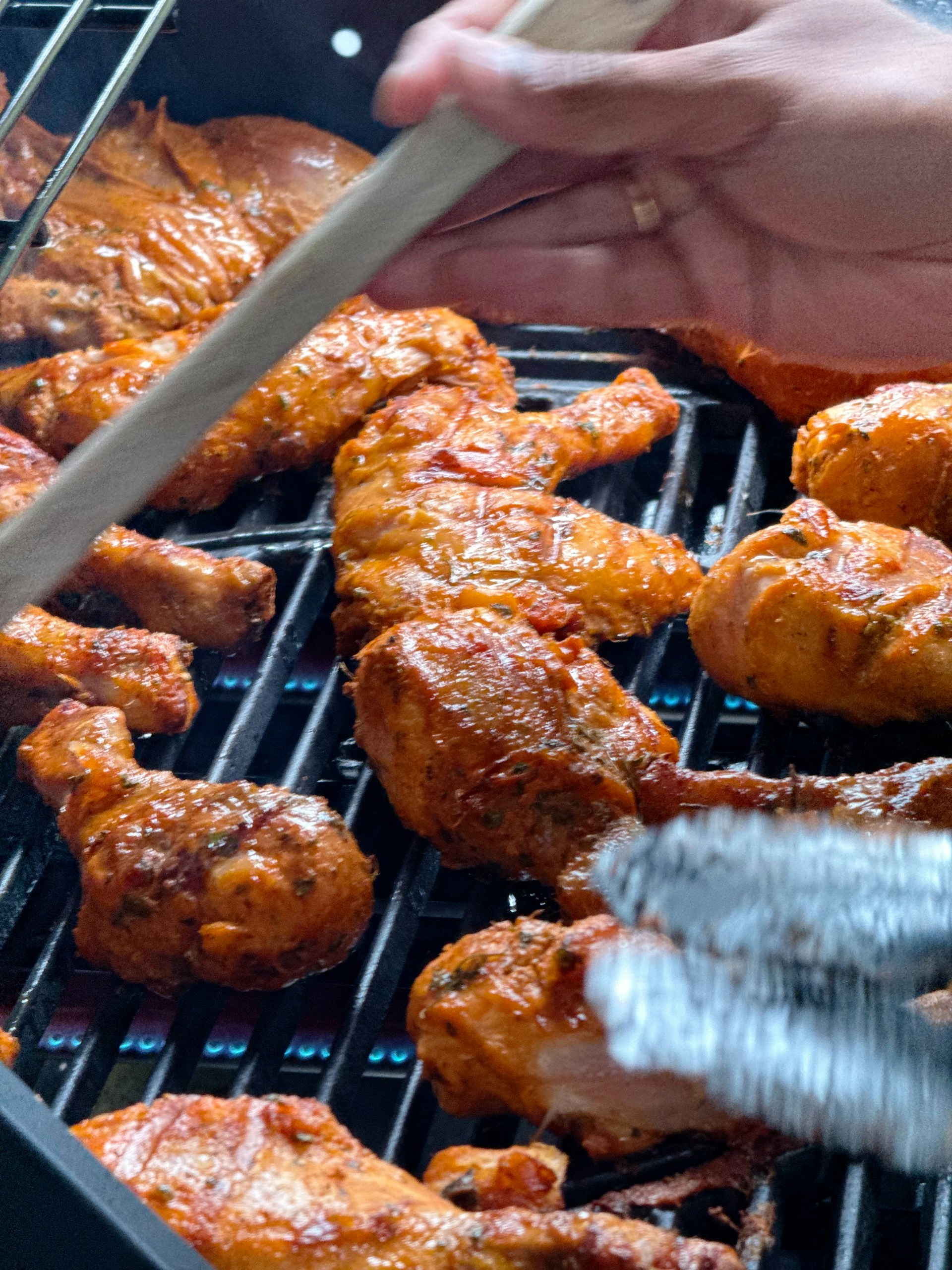 Chicken grilling on a barbeque.