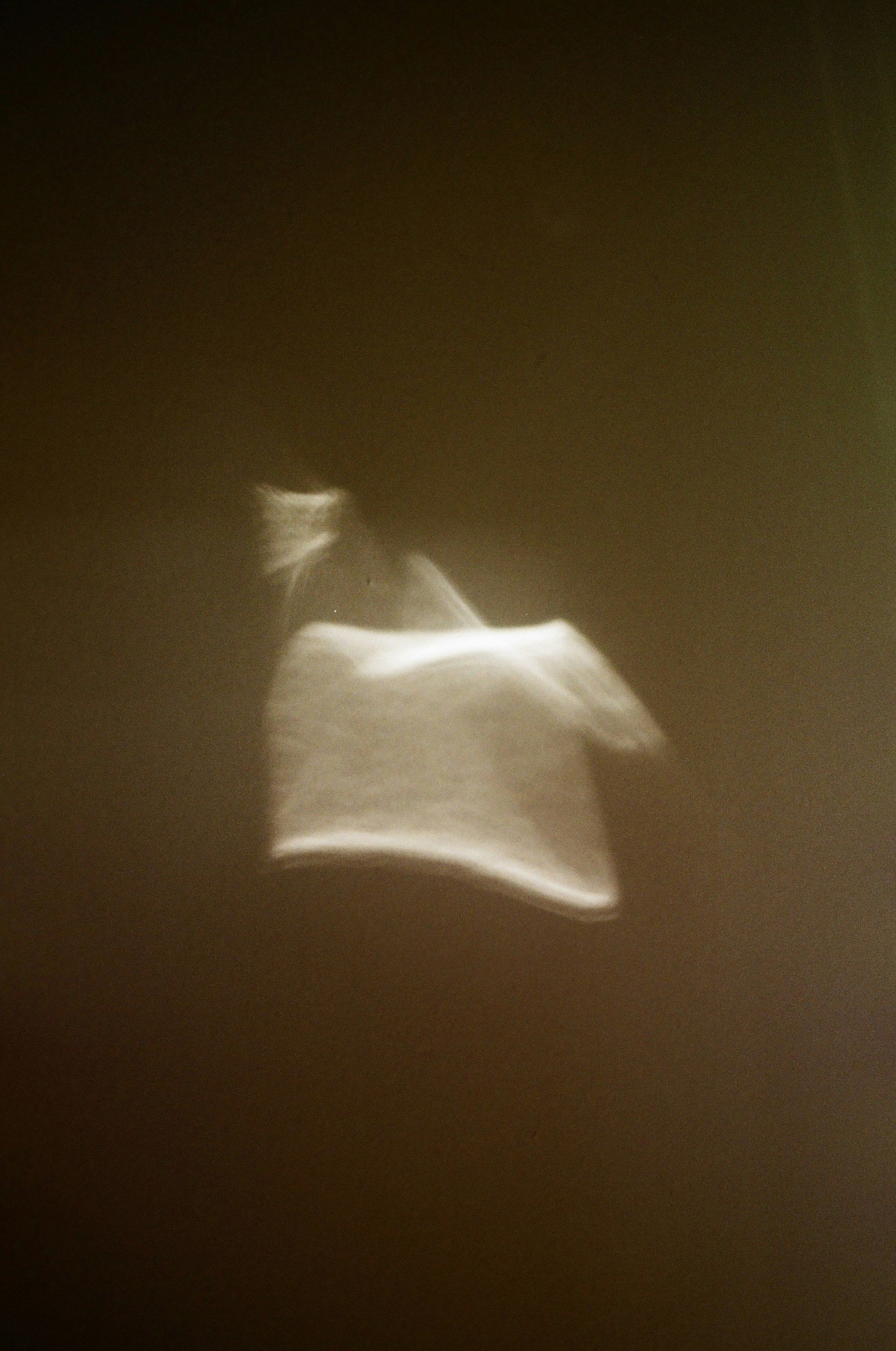 Abstract light reflections hovering in darkness.