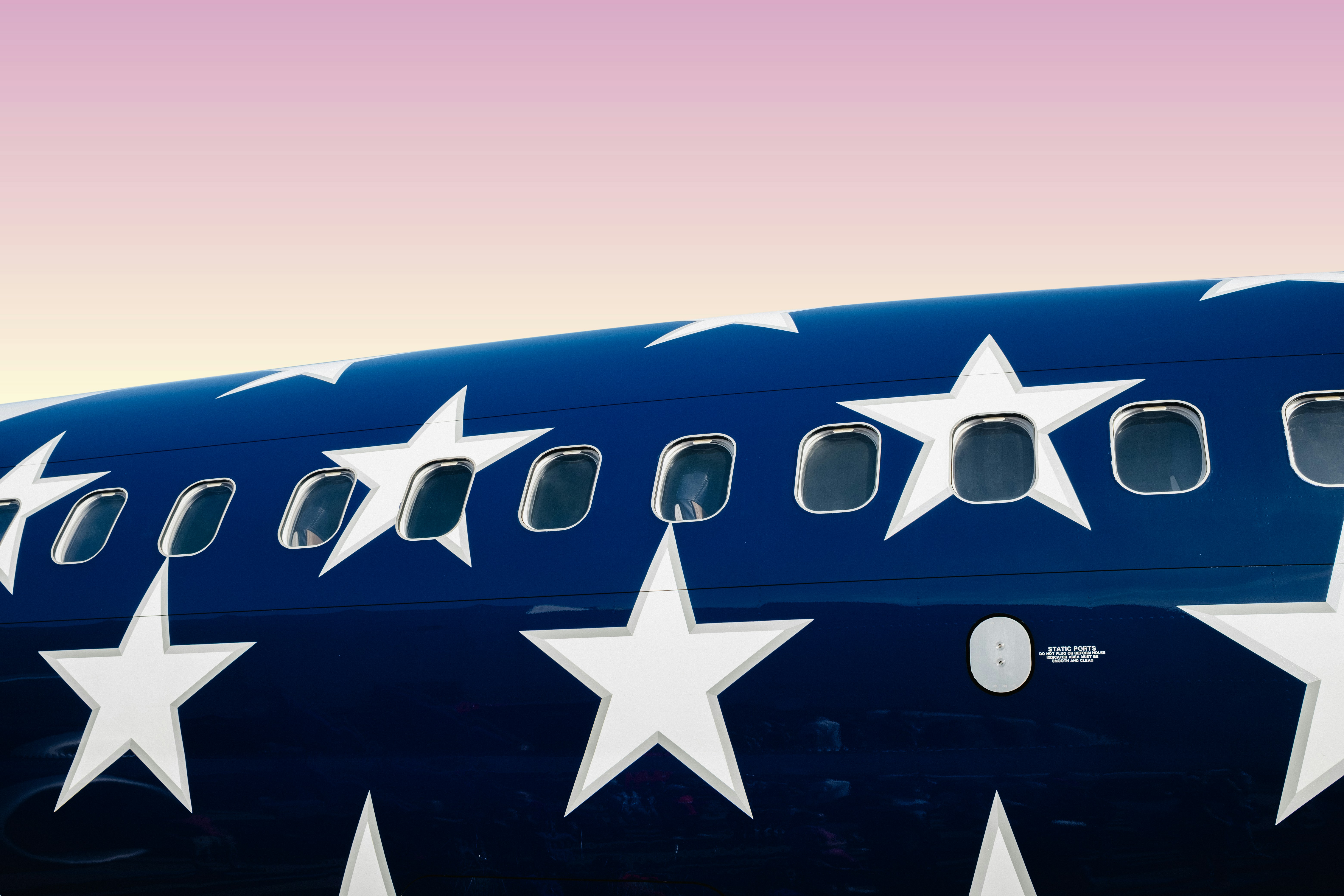 Airplane fuselage decorated with american stars.