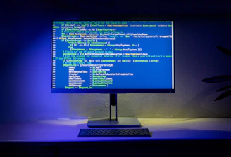 A computer screen displays code on a desktop.