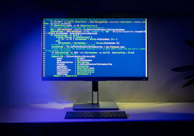 A computer screen displays code on a desktop.