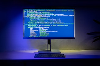 A computer screen displays code on a desktop.