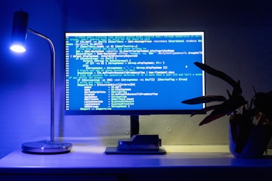 A computer screen displays lines of code.